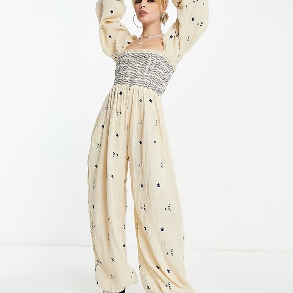 Elegant Cream Jumpsuit with Black Floral Accents